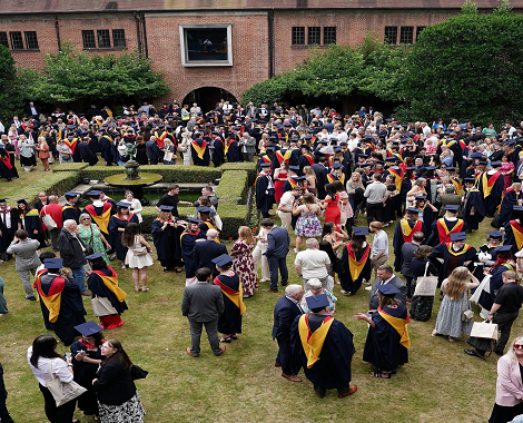 graduates on the lawn